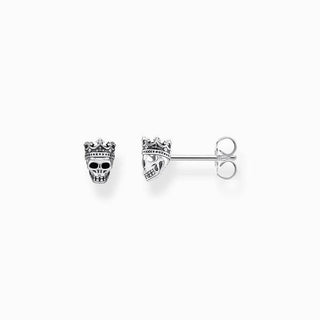 Thomas Sabo blackened sterling silver skull stud earrings featuring a crown with sparkling black zirconia stones.